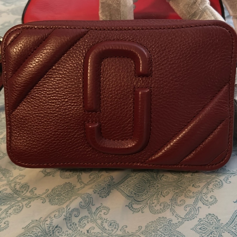Marc Jacobs Crossbody leather strap color Burgandy